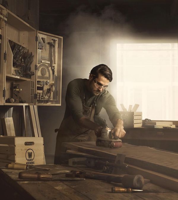 image of craftsman working with tools